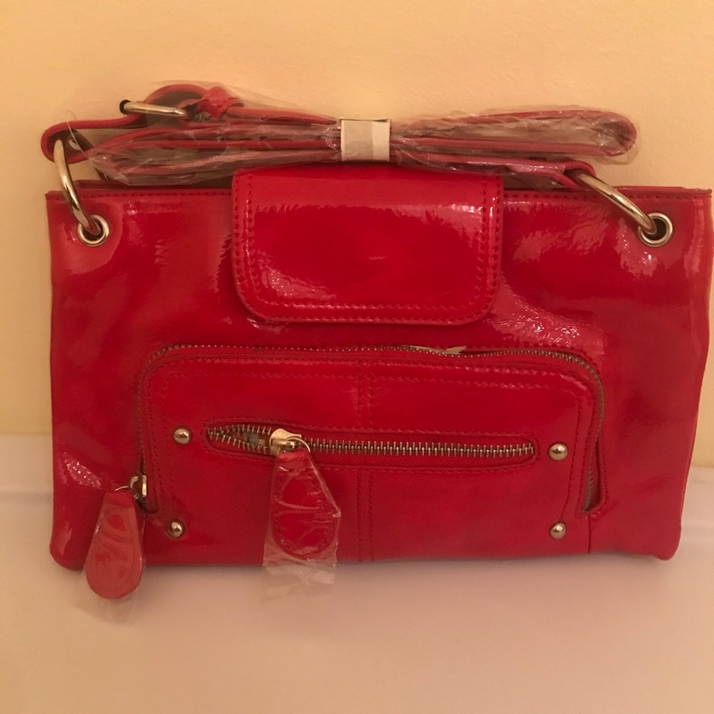 Red, patent leather bag with long strap